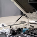 70 Series Land Cruiser bonnet held open by the fitted gas strut kit, viewed from the engine bay