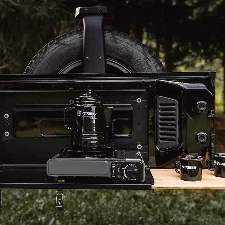 Drop Down Tailgate Table: tailgate table in use at camp
